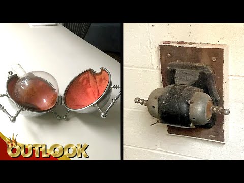 What Is This MYSTERIOUS Silver Shell With A German Flask And This Oblong Metal Object On A Wall?
